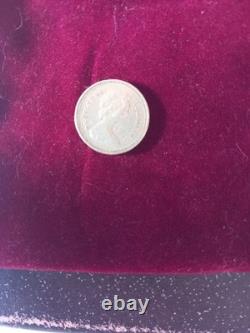 1983 pound coin First edition. Condition all writing visible all very rare