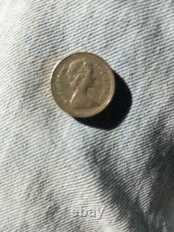 1983 pound coin First edition. Condition all writing visible all very rare
