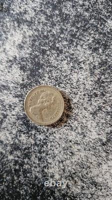 Pièce de monnaie de 1983 Première édition. État : toutes les inscriptions visibles, très rare.